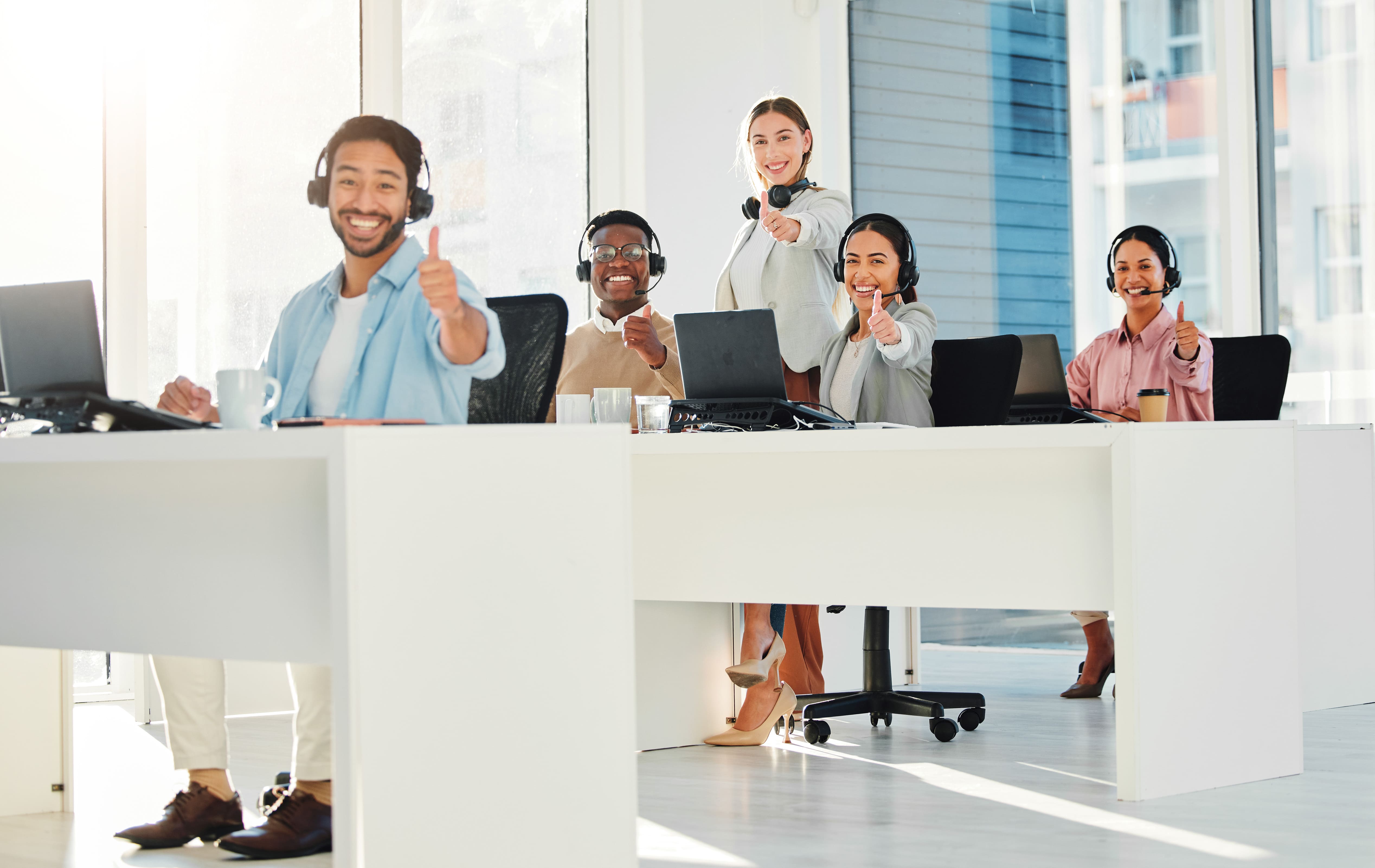 call-center-staff-group-and-thumbs-up-in-portrait-2025-04-06-08-15-08-utc (1)